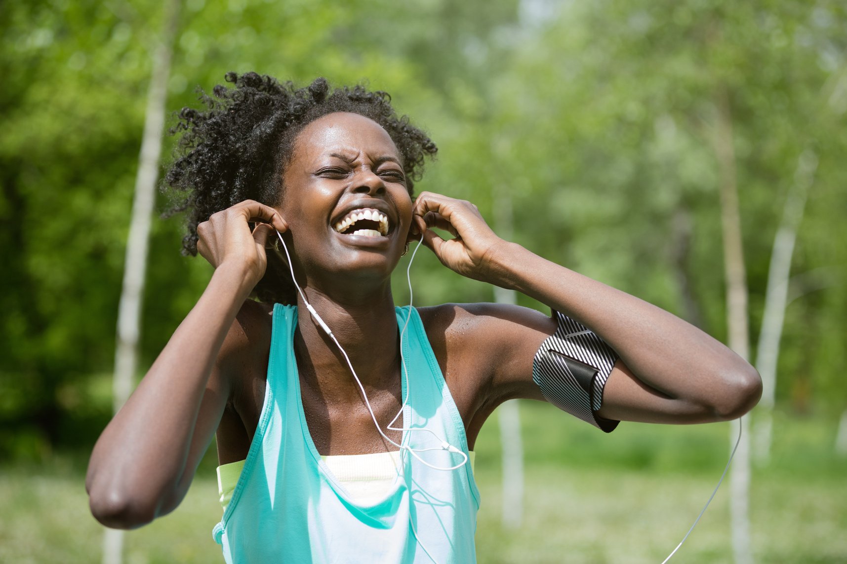 Black athlete enjoying music